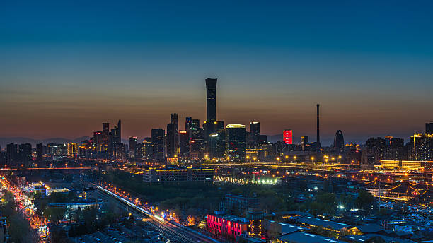 istock In China, a high-speed train cuts through the urban building complex in Beijing at twilight 2215652373