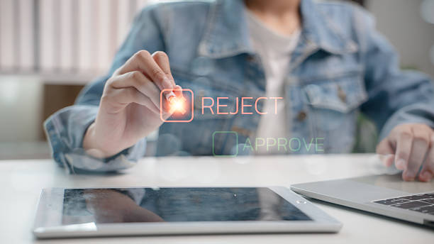 istock User tapping virtual reject button on digital interface with approve option faded. Concept of decision-making, business process control, form rejection, and digital workflow system. 2215654186