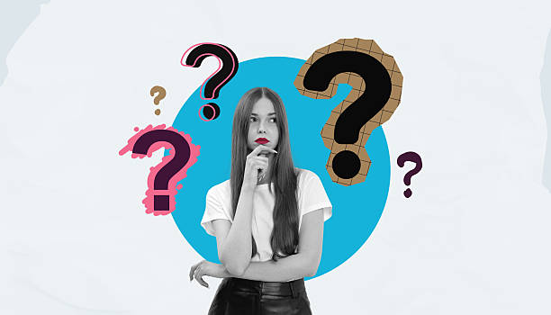 istock Thoughtful young woman surrounded by colorful creative question 2215661588