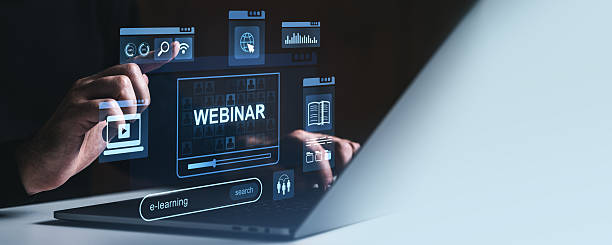 istock Webinar and e-learning concept with digital education icons on futuristic laptop screen. 2215662699