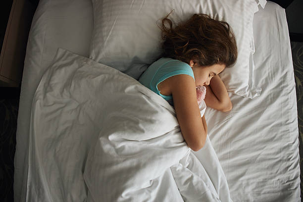 istock Beautiful girl sleeping 2215662943