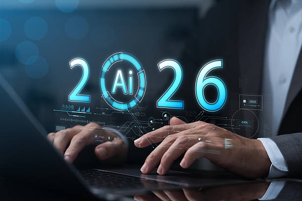 istock Businessman using laptop with AI 2026 hologram interface showing futuristic technology, innovation, artificial intelligence, data analysis, digital transformation, machine learning trends. 2215663122