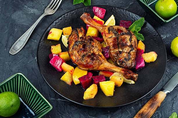 istock Served with tropical fruits, roast duck leg. 2215663775