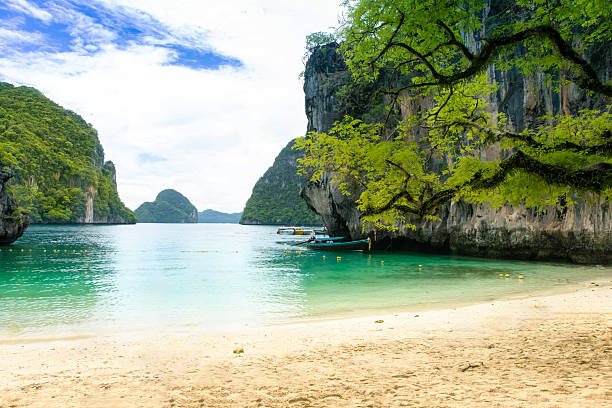 istock Lading Beach, with its white sand, crystal-clear emerald waters, beautiful limestone cliffs, and lush greenery, is in Krabi, Thailand. 2215667427