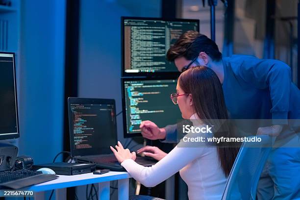 Asian Programmers Collaborating On Software Development At Night ...