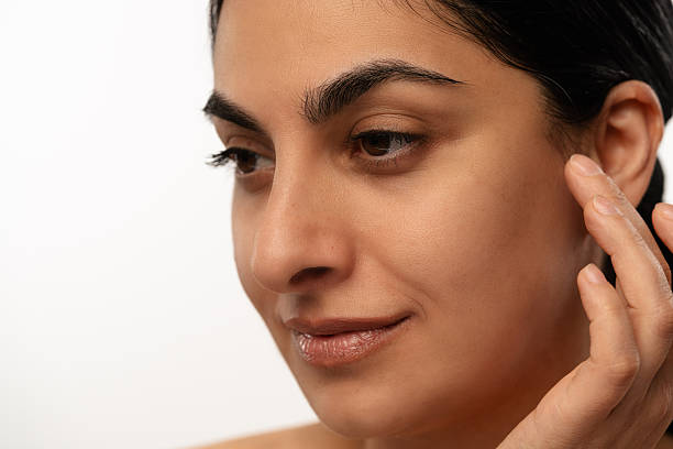 istock Woman Touching Her Face with Hand Gently 2215678449
