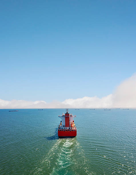 istock Aerial back view of a large sized, loaded container cargo vessel in transit. 2215680546