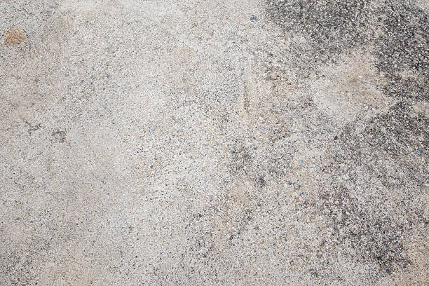 istock Exploring textured concrete surface in urban environment detailed image neutral lighting ground view 2215681273