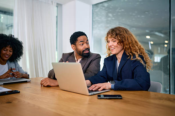 istock Business team working together on a laptop in a modern office 2215688156