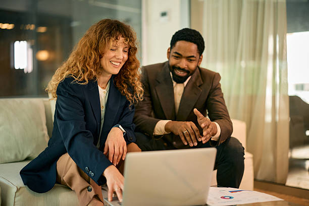 istock Business partners reviewing data on laptop in modern office 2215688326