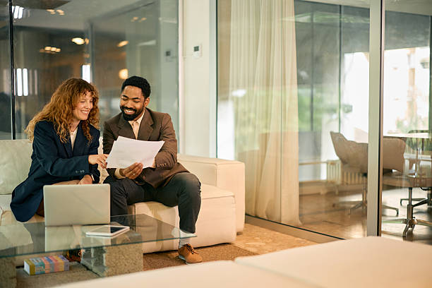 istock Business partners reviewing documents in modern office space 2215688331