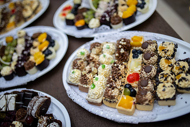 istock Assorted desserts displayed on elegant platters at a festive gathering in an indoor setting during the afternoon 2215690288