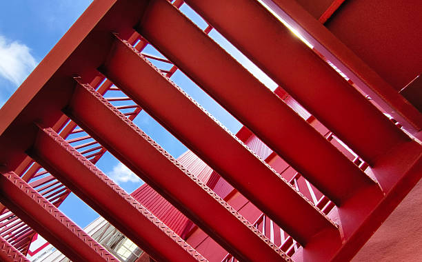 istock A set of stairs ascending a large red wall 2215695665