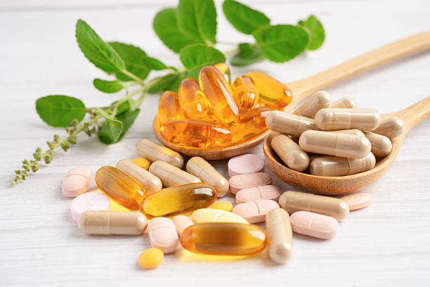 istock Alternative medicine herbal organic capsule drug herb. 2215697140