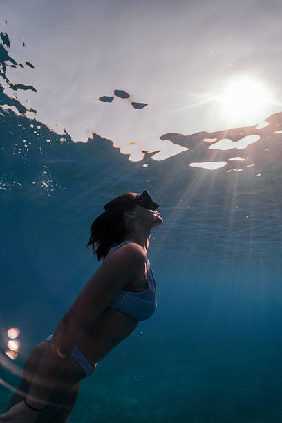 istock Beautiful woman diving underwater 2215697503