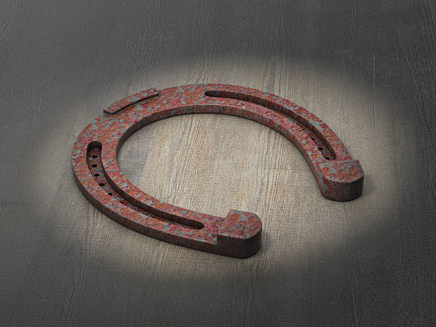 Close-up of a horseshoe - a symbol of good luck, pictured in the pavement in the village of Godshill, on the Isle of Wight, UK.
