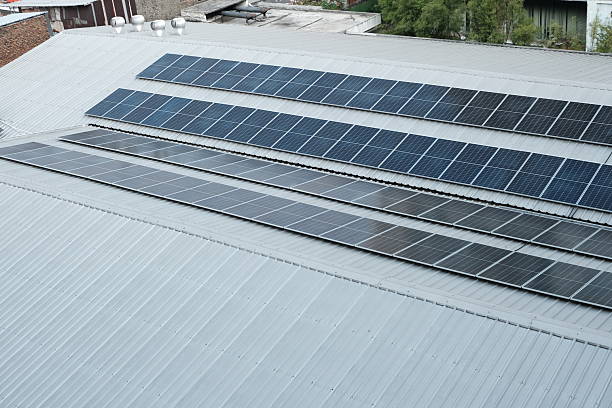 istock Rows of solar panels installed on a metal rooftop, capturing clean energy from sunlight as part of a sustainable power system. 2215699002