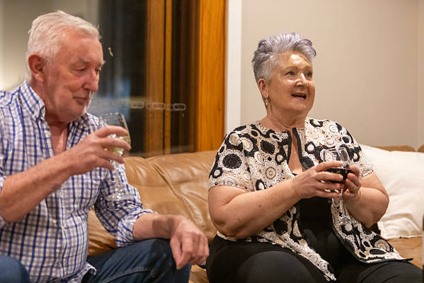 istock Friends drinking wine together on a living room sofa 2215699655