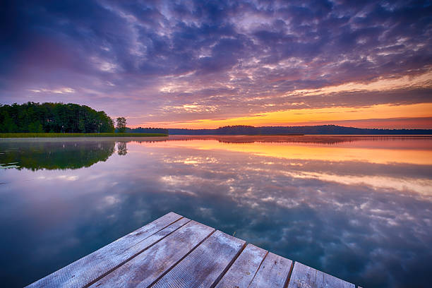 istock Beautiful summer sunrise over lake 2215700044