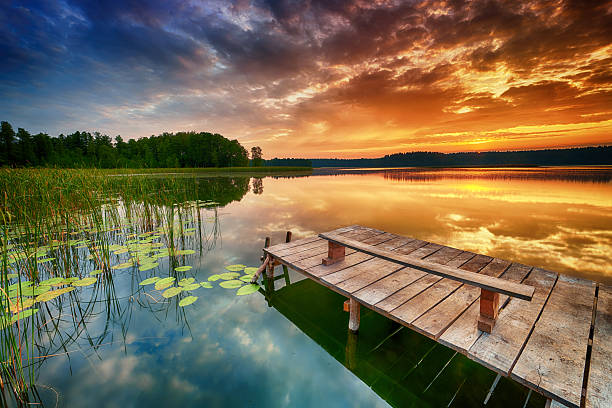 istock Beautiful summer sunrise over lake 2215700304