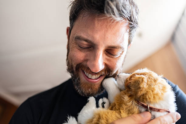Smiling man enjoying playful moment with his pet