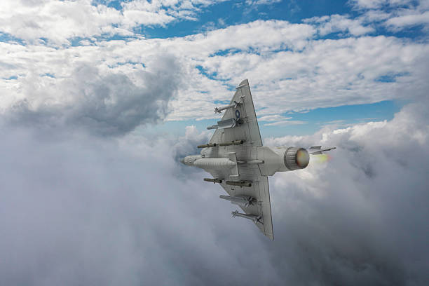istock Jet aircrafts flying over the clouds. 2215702524