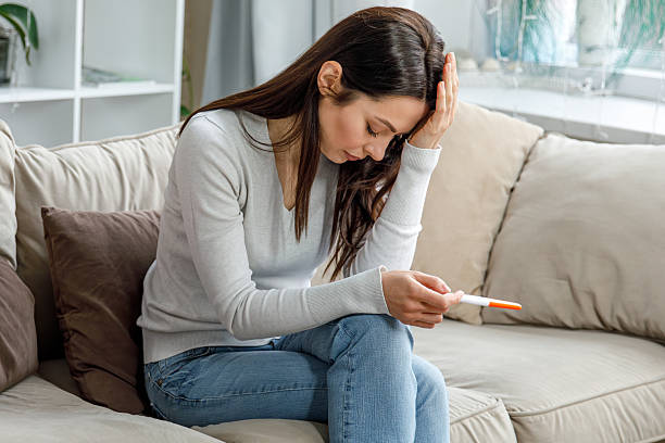 istock Disappointed woman after negative pregnancy result 2215702652