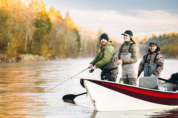 istock Young couple on guided drift fishing trip on river 2215706387