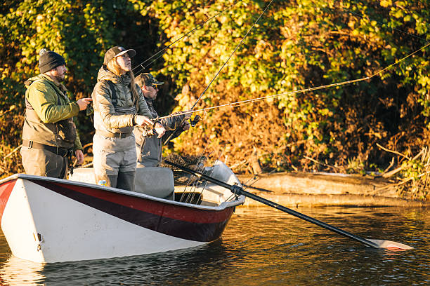 istock Young couple on guided drift fishing trip on river 2215706537