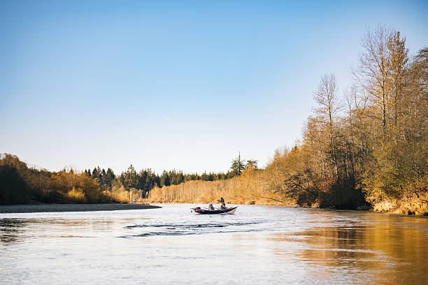 istock Young couple on guided drift fishing trip on river 2215706644