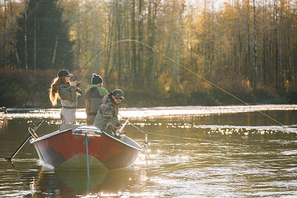 istock Young couple on guided drift fishing trip on river 2215707247