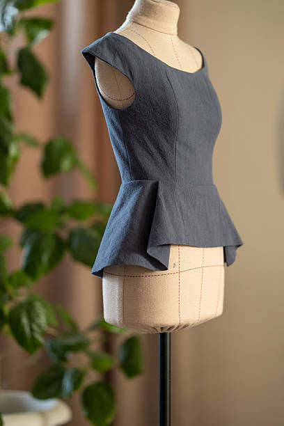 istock Foreground Plant with Blurred Mannequin 2215707464