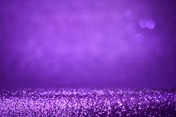 istock Abstract violet sparkles bring a glamorous glow to your Christmas celebration. 2215707992
