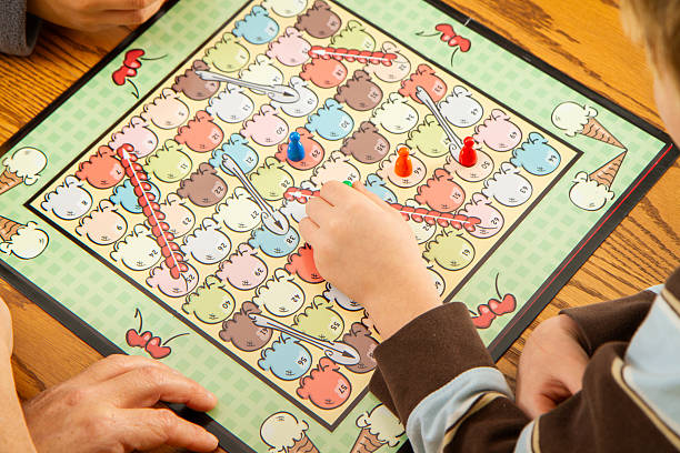 Family playing board games. All artwork was created by the photographer/artist.