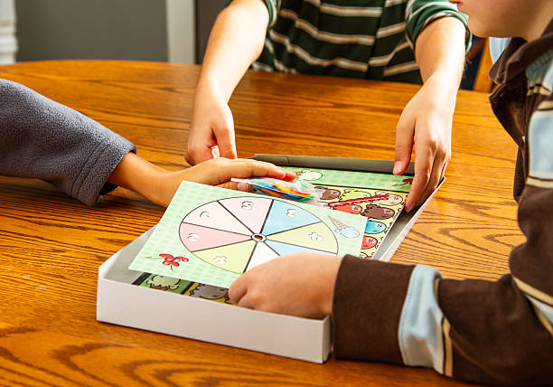 Family playing board games. All artwork was created by the photographer/artist.