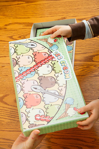 istock Family Getting Ready To Play A Board Game Together 2215712737