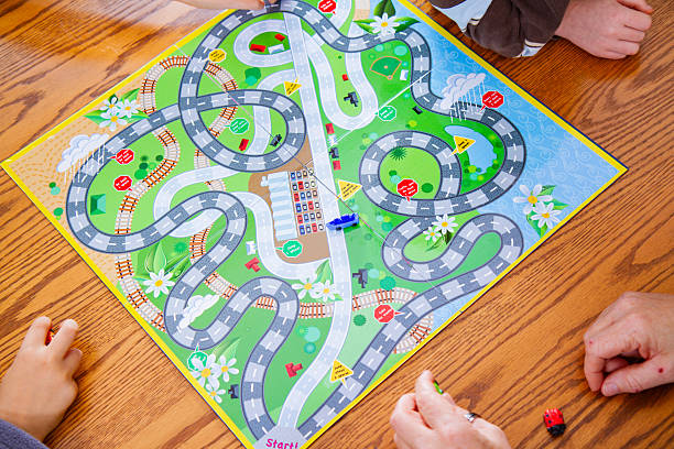 istock Family Playing A Colorful Board Game Together 2215713334