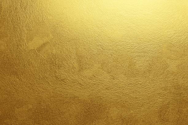 Brushed Gold Brushed gold glows with quiet sophistication, its fine linear texture revealing a handcrafted elegance. The rich metallic luster suggests timeless refinement and material wealth. gold metal stock pictures, royalty-free photos & images