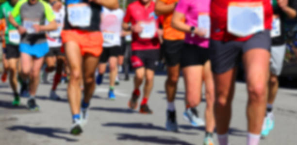 istock Intentionally blurry background with the many runners running 2215715427