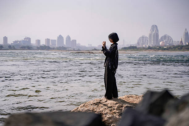 The girl taking a photo in the natural environment