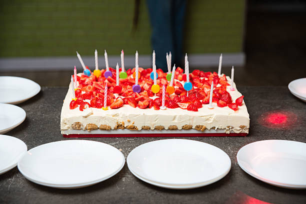 cheesecake birthday cake with raspberries and candles . High quality photo isolated
