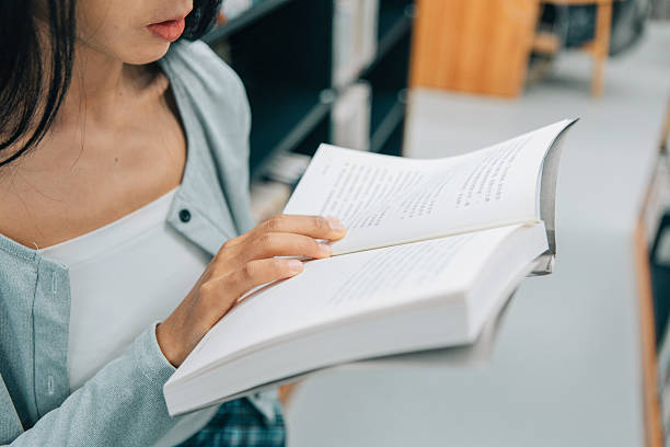 istock The girl is reading in the library 2215726446