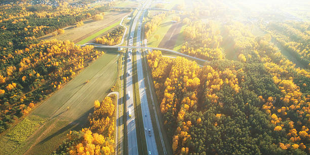 istock Drone view of highway in autumn scenery 2215727404