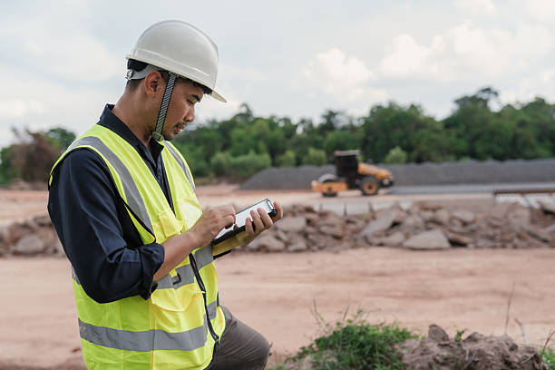 istock Civil engineer using tablet at railway construction site, focusing on inspection and project management tasks. 2215732795