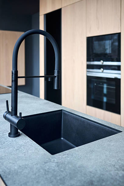 istock Single handle water filter kitchen faucet for reverse osmosis or water filtration system built in compact high pressure laminate HPL countertop. Kitchen undermount installation granite composite sink. 2215737329