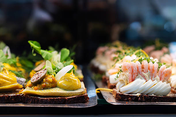 istock Smorrebrod, a classic Danish open sandwich made with dark rye bread, topped with shrimp, fish or meat. 2215740175