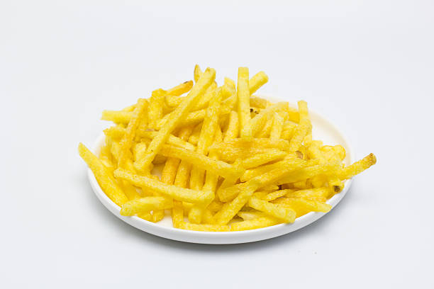 Plate of crispy chips on a white background