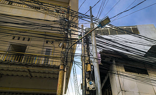 istock Overhead Power Lines and Electrical Wires in an Urban Setting 2215749411