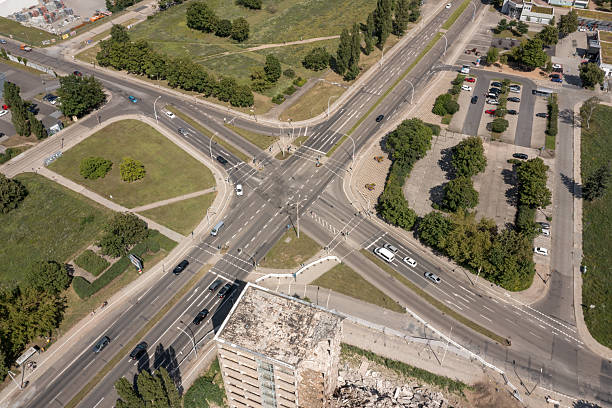 View from above on a road junction and a house demolition. The house was an office building from the time of the GDR. Eisenhuttenstadt, Brandenburg, Germany
