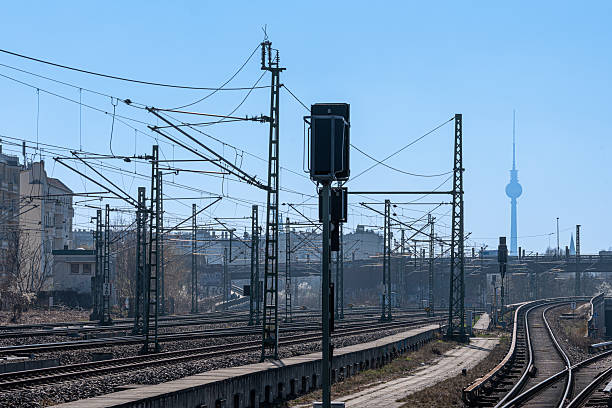 Germany, Berlin, Prenzlauer Berg, March 28, 2025 - Railway tracks and signal against clear sky